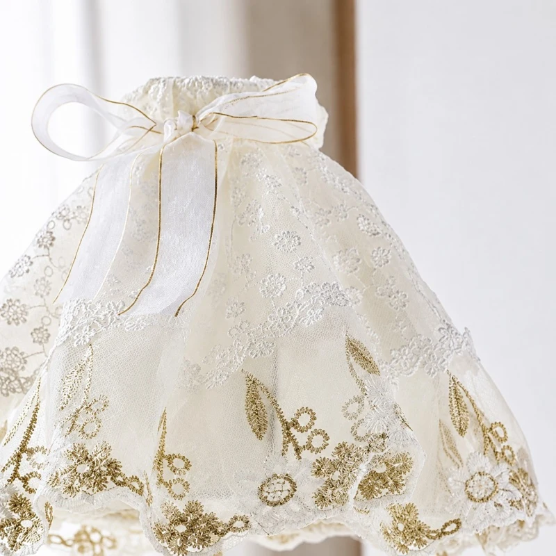 Embroidered lace lampshade with bow and floral stitching detail