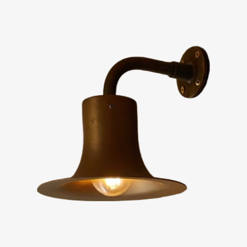 Antique brass wall sconce with warm bulb glow