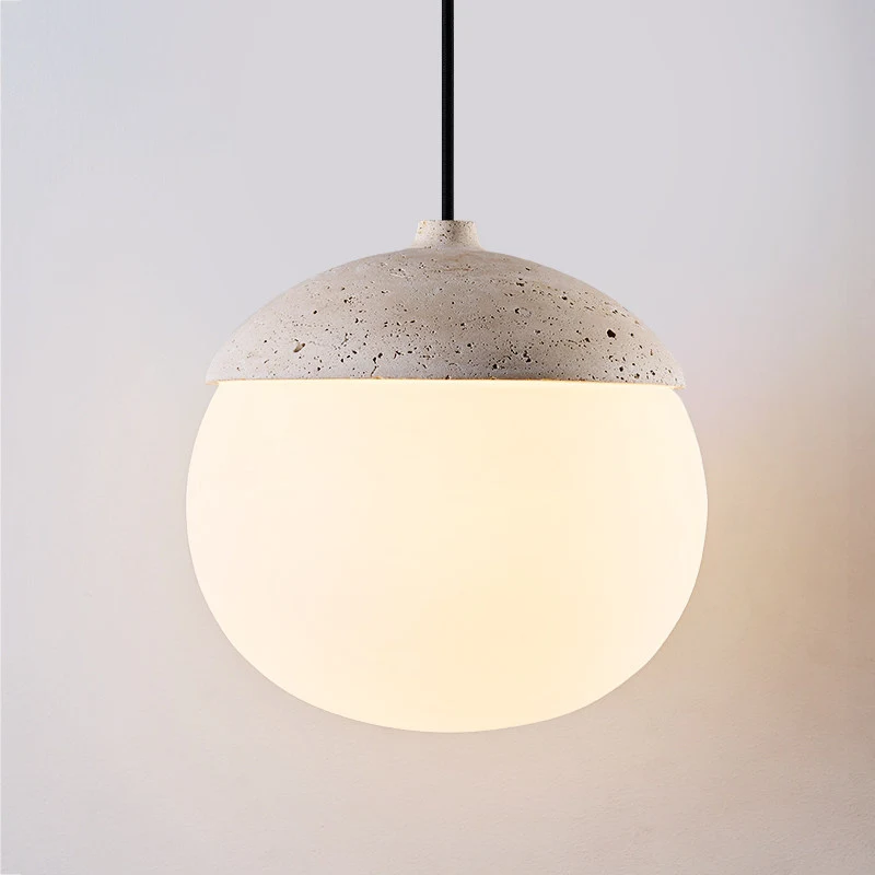Lit shade detail showing warm bulb glow through the pendant form