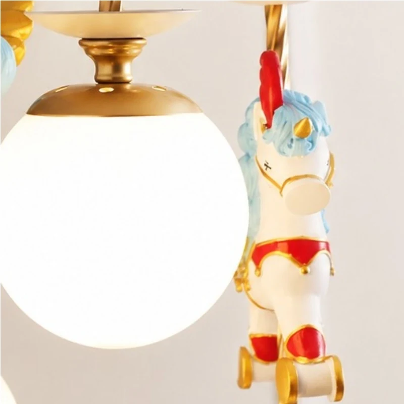 Close up of frosted glass globe shade and unicorn ornament