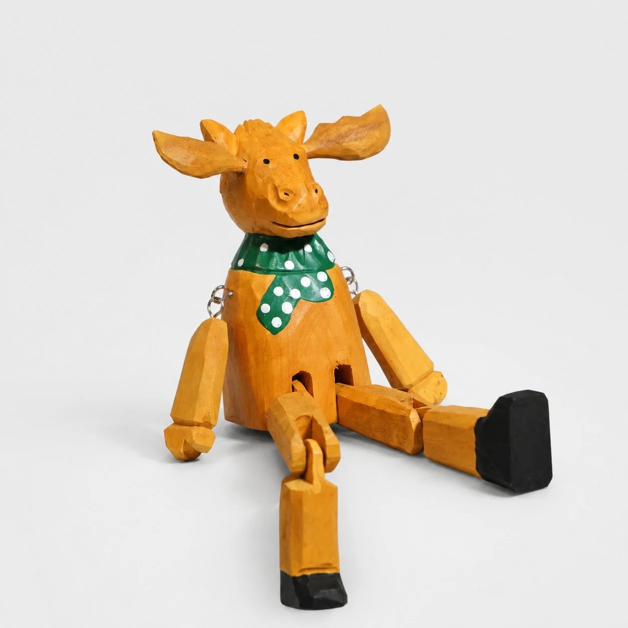 Hand-carved wooden christmas reindeer with green scarf ornament
