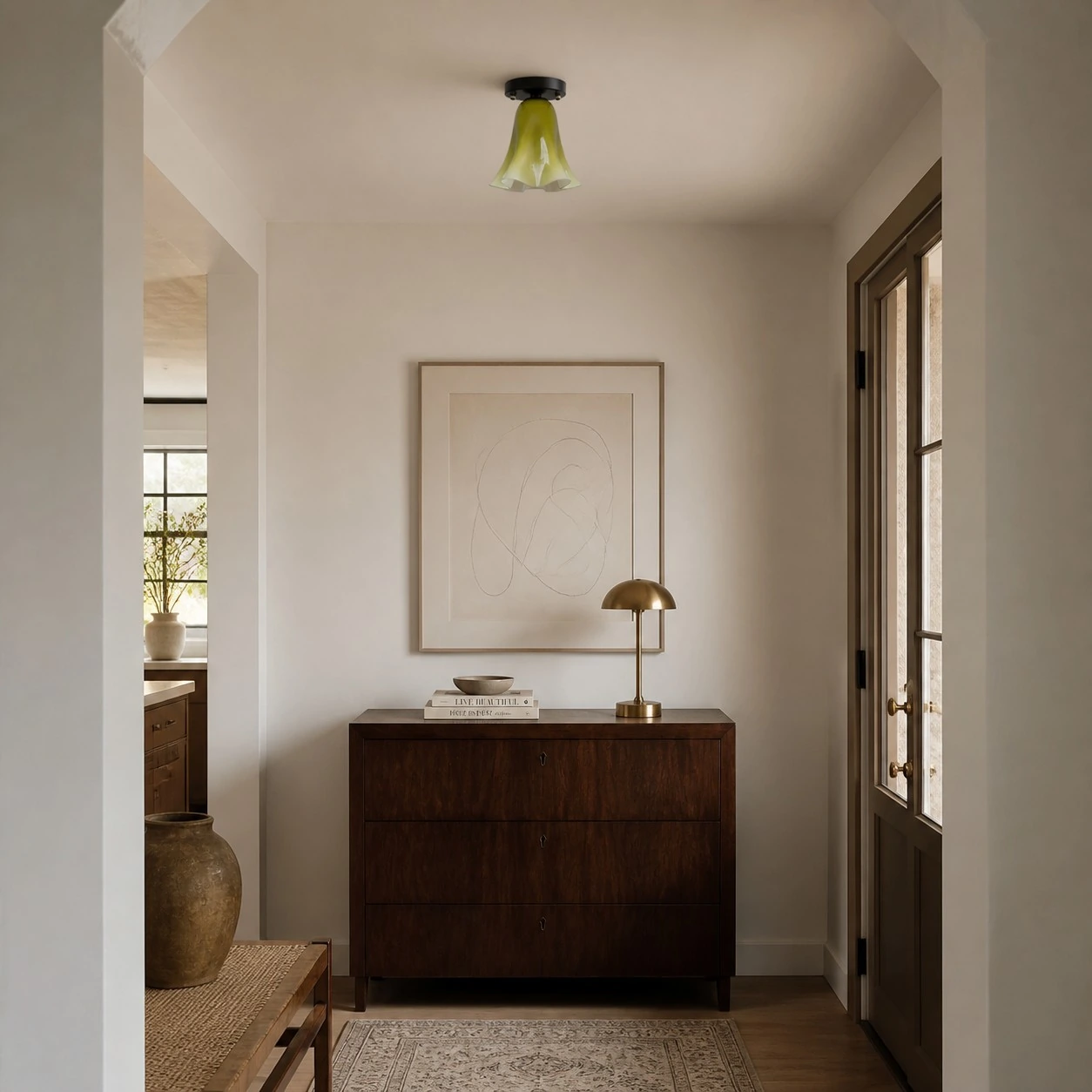 Gradient green glass flush mount light in an entryway